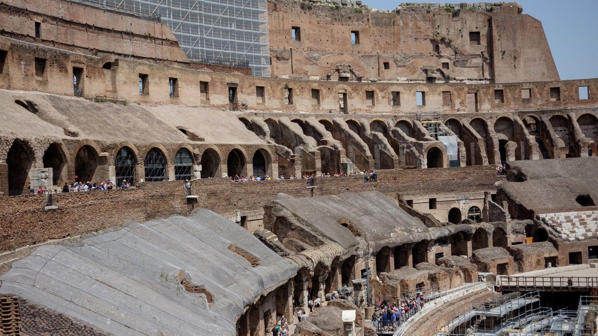 Explore the ancient ruins of the Colosseum, a historic landmark in Rome, Italy, showcasing its impressive architecture.