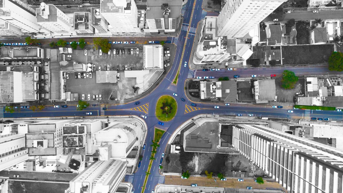 High-angle aerial shot of a bustling intersection in Balneário Camboriú, Brazil.