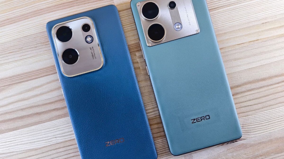 Two sleek smartphones displayed on a wooden table, showcasing modern design and dual lenses.
