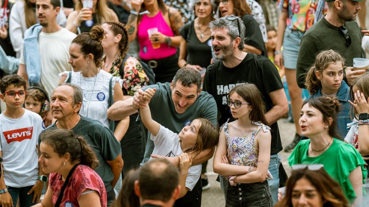 Diverse group of people enjoying a vibrant outdoor festival, capturing joy and community spirit.