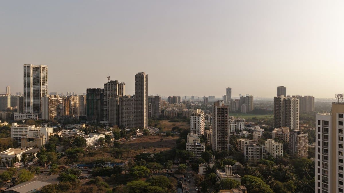 Aerial view capturing the modern skyline of Mumbai's urban architecture during the day.