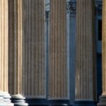 Elegant neoclassical columns showcasing architectural grandeur in St. Petersburg, Russia.