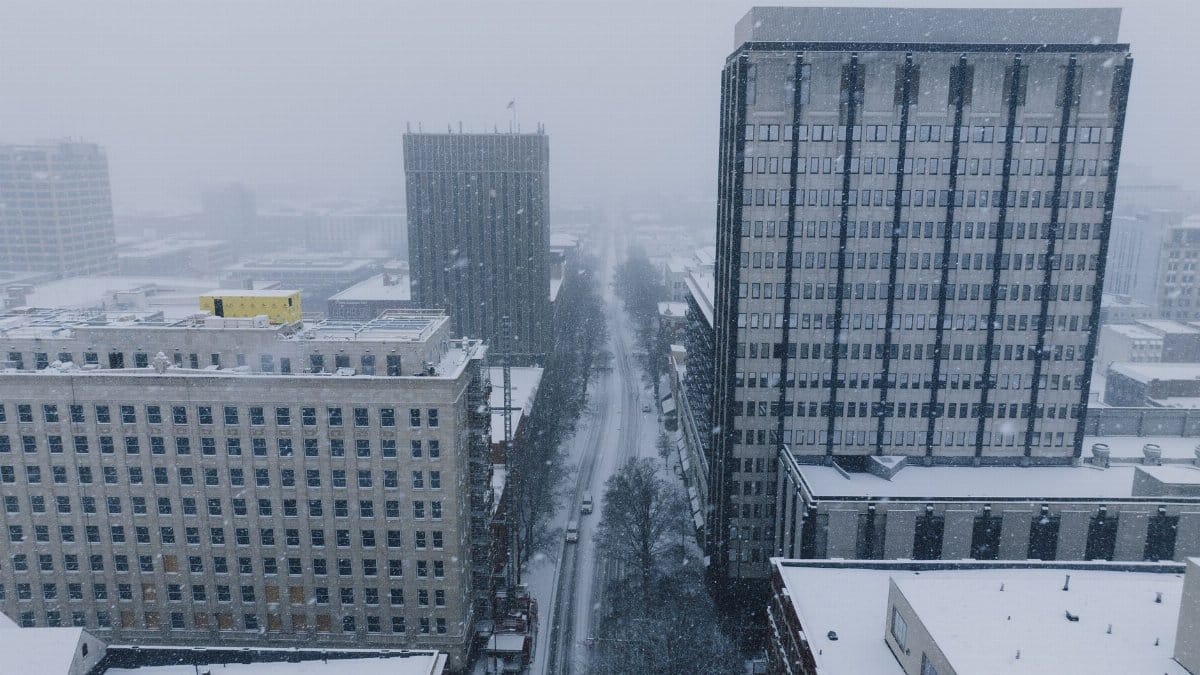 Aerial shot of a snowy cityscape in Chattanooga during winter.