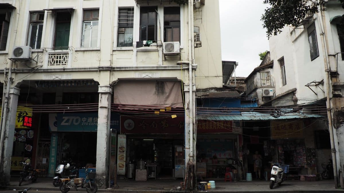 Street view showcasing historic market shops and traditional architecture in an urban setting.