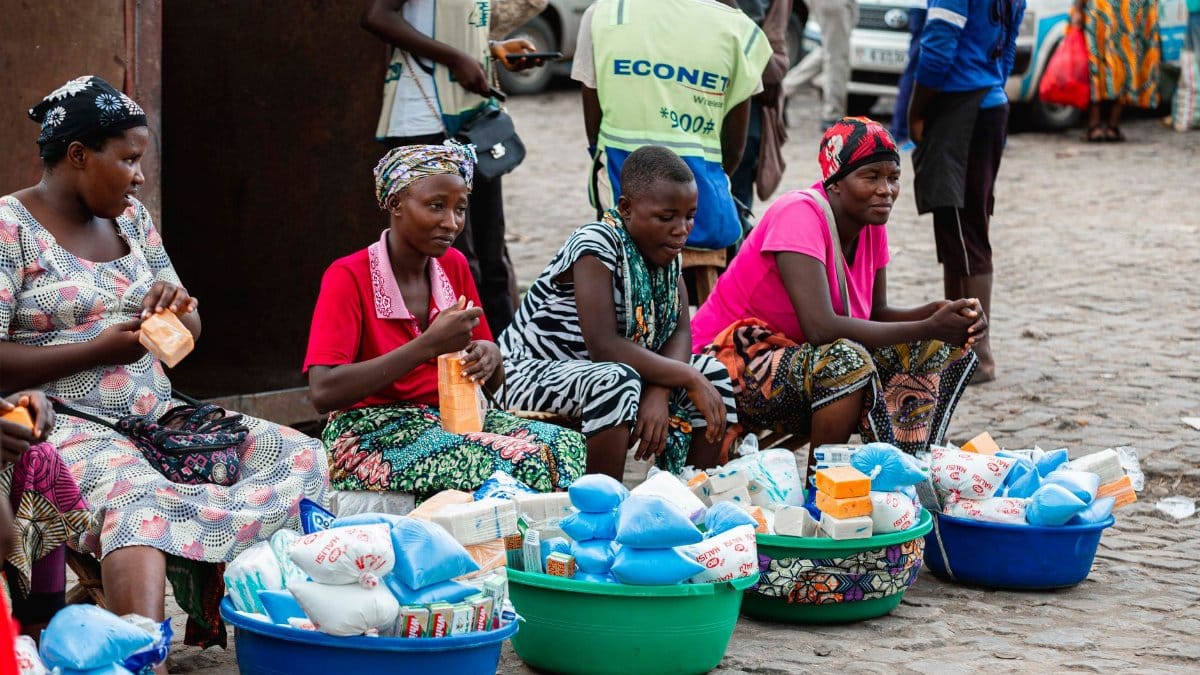 Women selling goods at a vibrant street market in Bujumbura, showcasing local commerce.