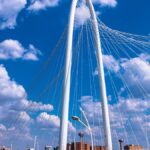 Margaret Hunt Hill Bridge against a vibrant Dallas skyline, showcasing modern architecture.