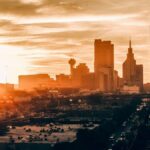Stunning Dallas skyline at sunset, showcasing vibrant colors and iconic architecture.