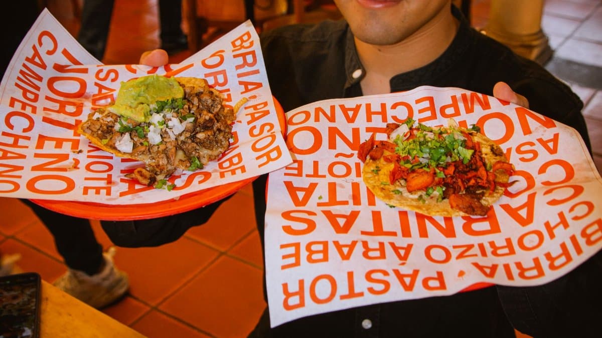 Two delicious tacos with vibrant garnishes in San Pedro Cholula, Puebla, showcasing Mexican street food culture.
