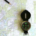 A detailed topographic map of Dunnellon, Florida with a compass and pencil.