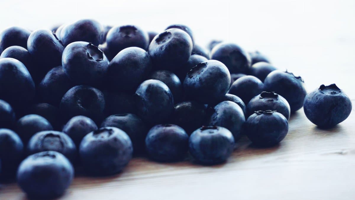 A pile of fresh blueberries showcasing their natural color and texture, perfect for healthy eating.