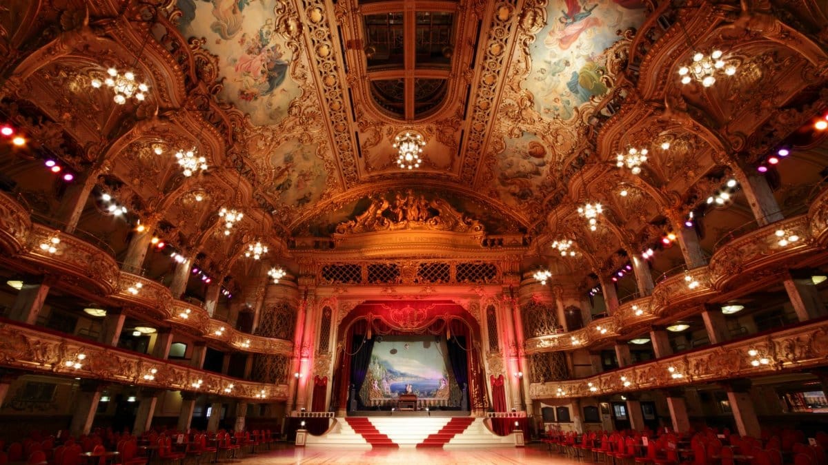 Stunning view of the historic Blackpool Tower Ballroom's ornate interior with elegant chandeliers and detailed ceiling artwork.