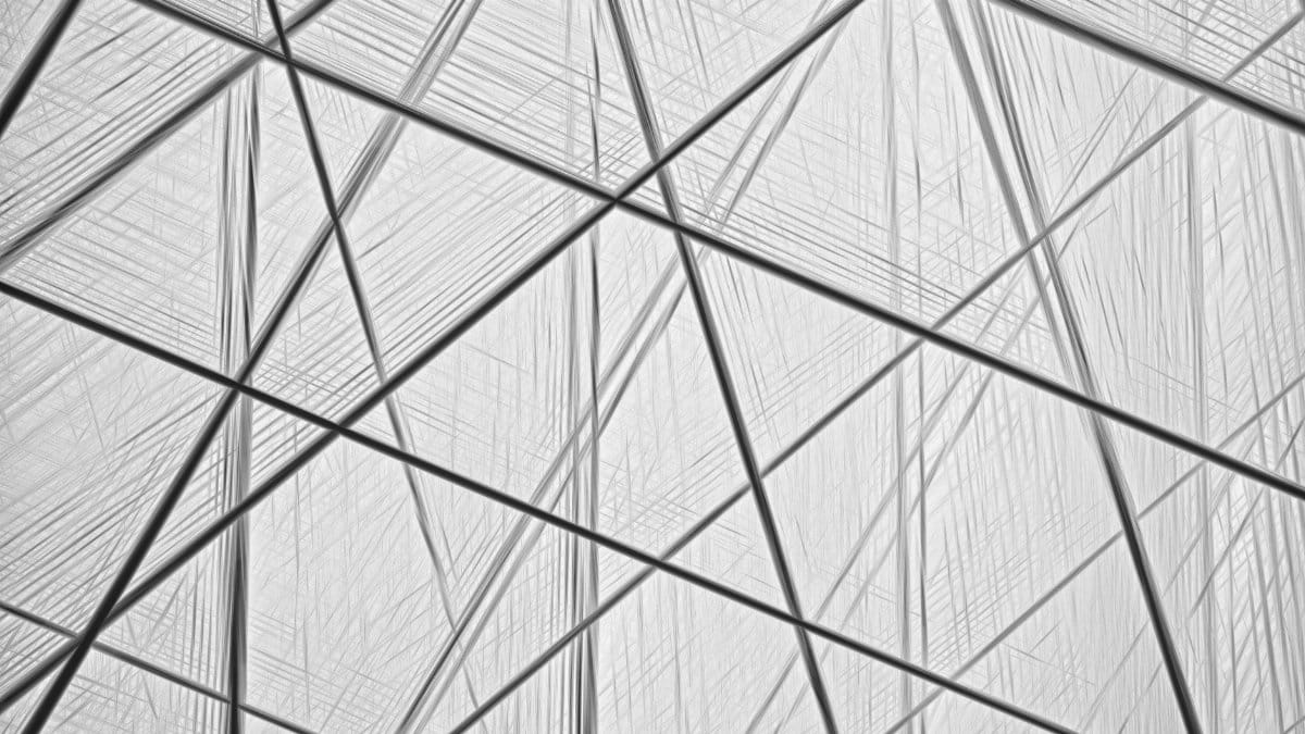 Intricate abstract architectural image with intersecting geometric lines and shapes, embodying modern minimalism.