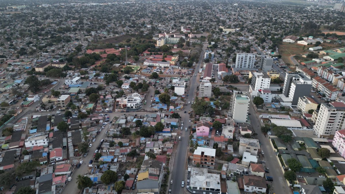 Aerial photograph showcasing the urban landscape of Matola, Mozambique, revealing dense residential and commercial areas.