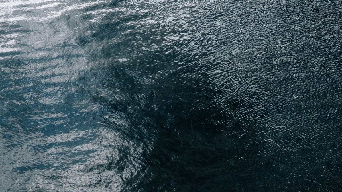 Peaceful ocean surface with gentle ripples, perfect for backgrounds and design uses.