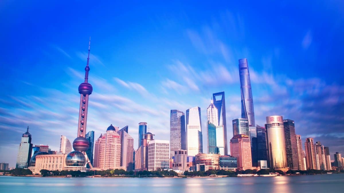 Vibrant Shanghai skyline featuring the iconic Oriental Pearl Tower and modern skyscrapers.