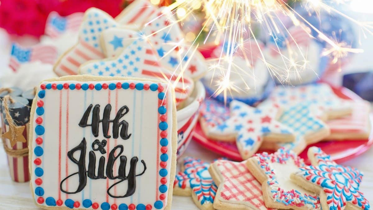 Indulge in patriotic 4th of July cookies with festive decorations and sparklers.