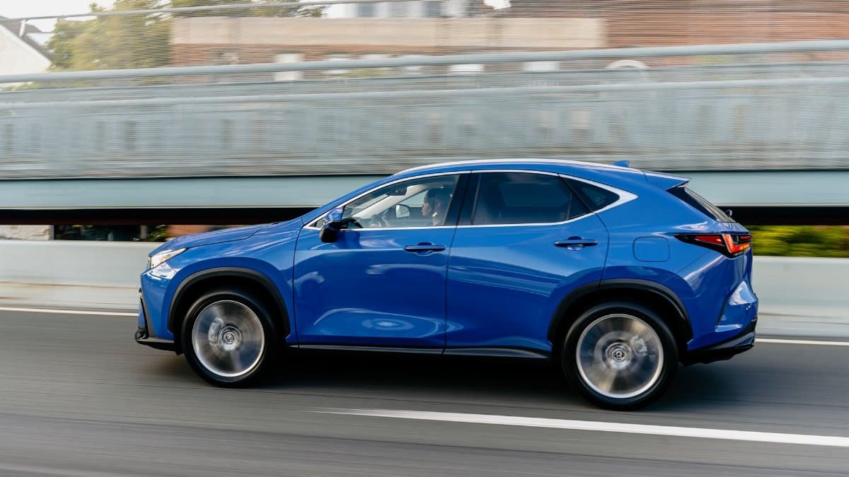 A vibrant blue SUV in motion, showcasing dynamic speed on a city road.