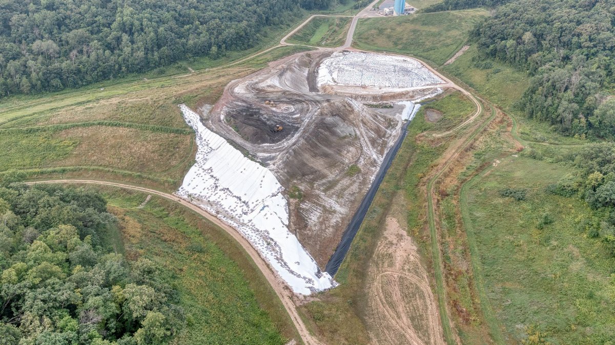 Aerial view of a construction site near Alma, WI, showing landscape and industrial development.