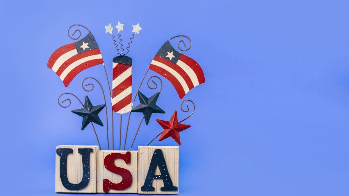 Patriotic USA decoration with flags and stars against a blue background.