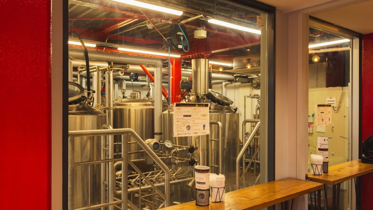 A view inside a craft brewery in Adachi City, Tokyo showcasing brewing equipment.