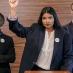 Determined political leaders standing together, promoting voter engagement.