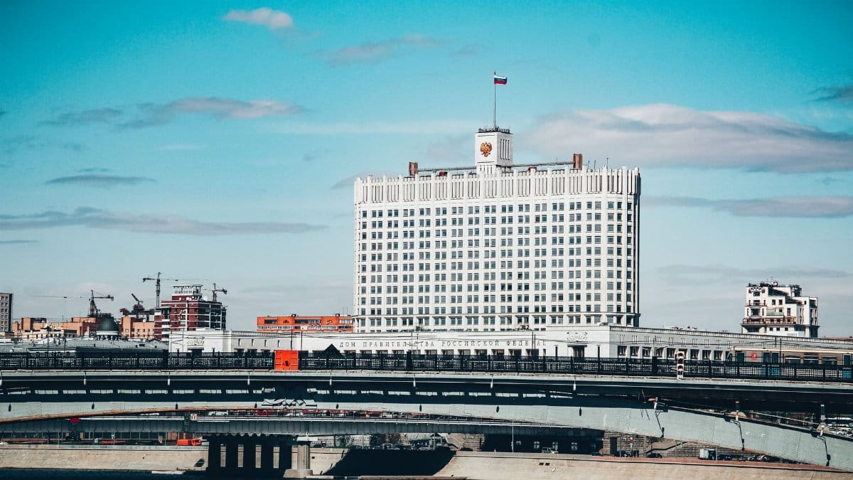 View of the Russian government building and bridge on a clear day in Moscow.