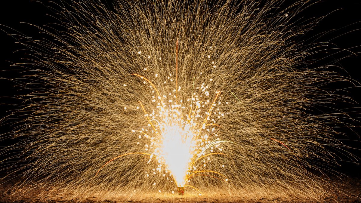 A stunning display of fireworks lighting up the night sky at Santa Rosa Beach, Florida.
