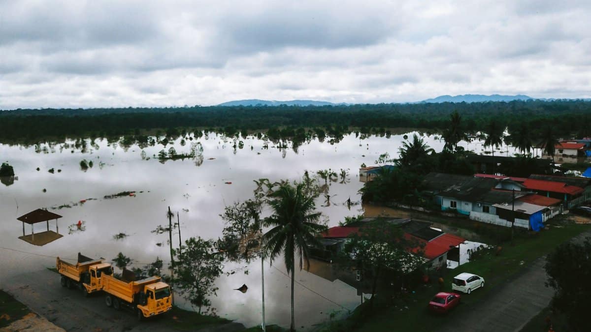 Aerial view of a flooding landscape in Kijal, Terengganu, Malaysia, illustrating the impact of natural disasters.
