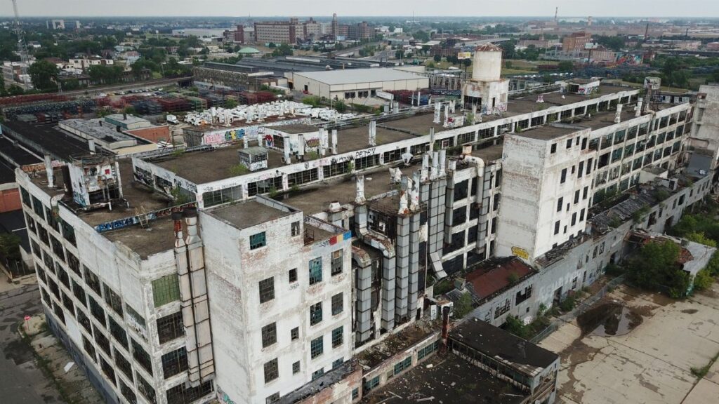 Drone shot of a large, abandoned industrial building in Detroit, Michigan.