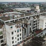 Drone shot of a large, abandoned industrial building in Detroit, Michigan.