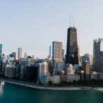 Stunning aerial view of Chicago's skyline with iconic skyscrapers along the lakeshore at dusk.