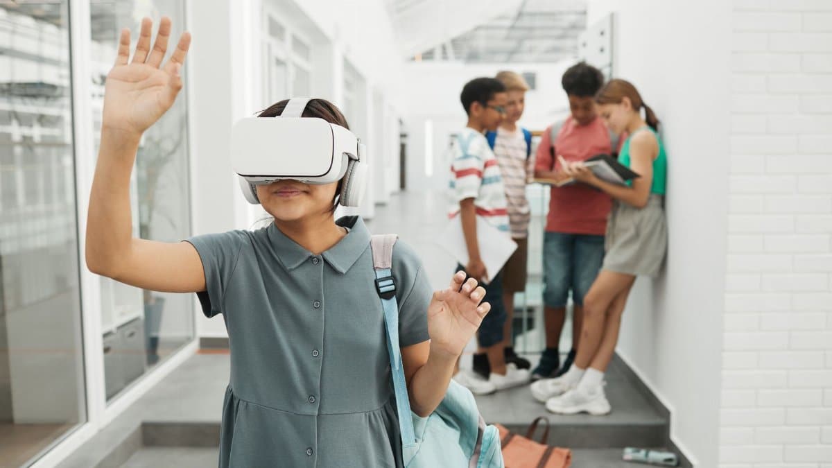 Group of kids using VR in school hallway, exploring technology and learning.