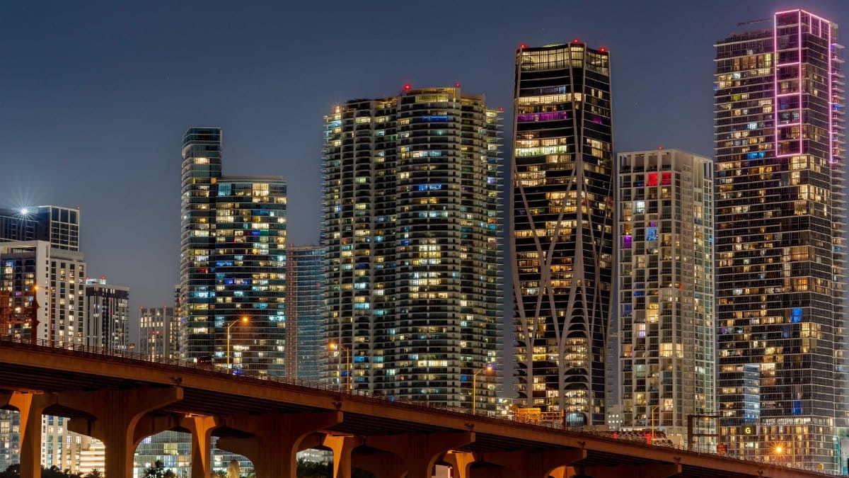 Captivating view of Miami's illuminated skyline and skyscrapers at night.