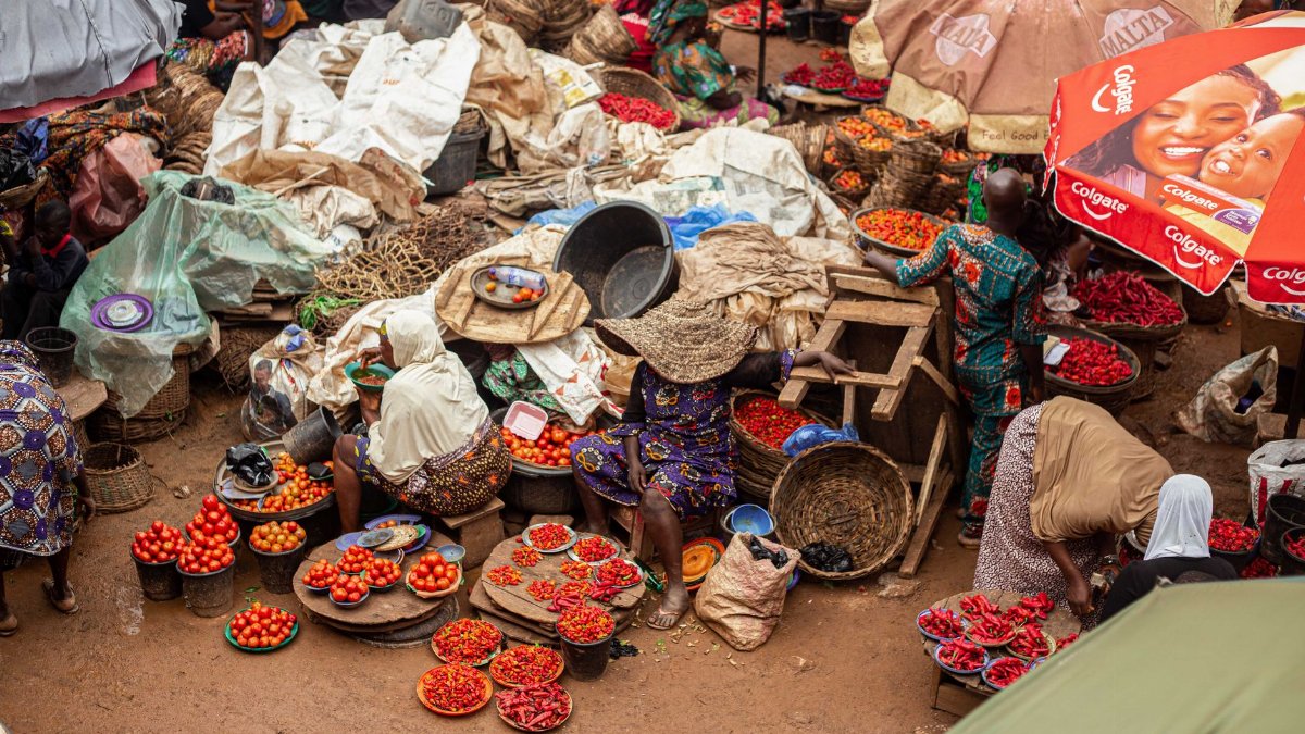 Colorful market depicting daily life in Ibadan, Nigeria with fresh produce and bustling activity.
