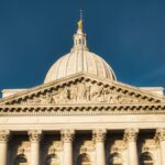 Stunning view of Wisconsin State Capitol building against a clear blue sky in Madison.