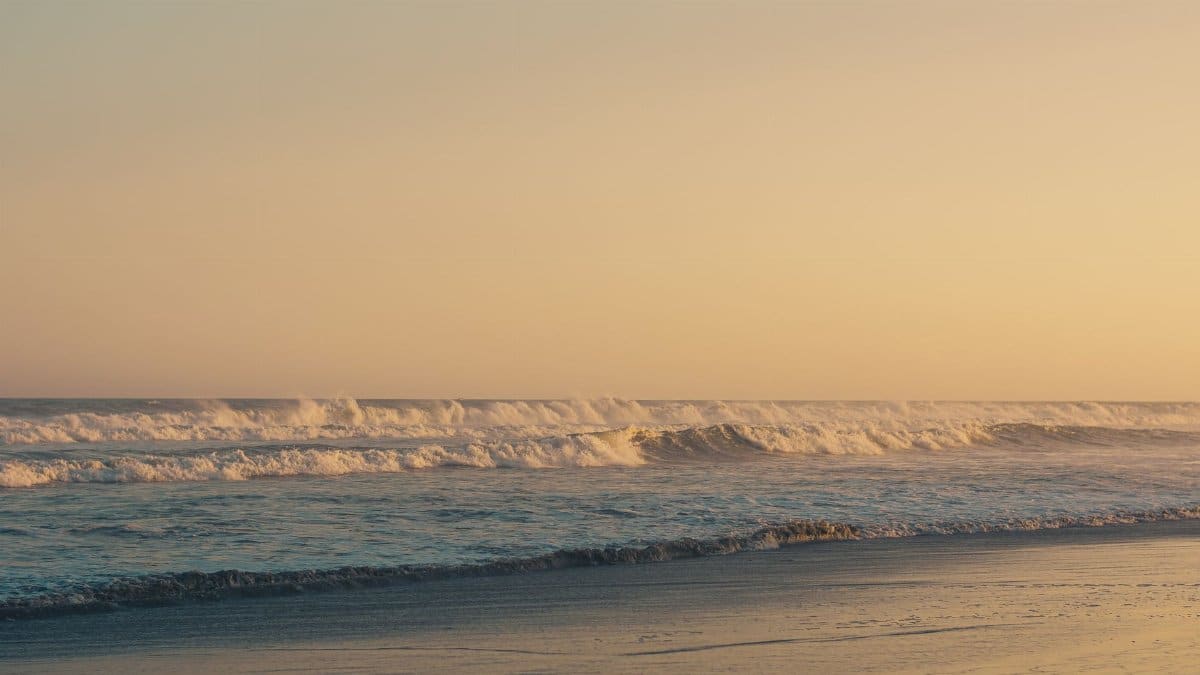 Capture of a tranquil sunset over the ocean waves at Accra beach, Ghana.
