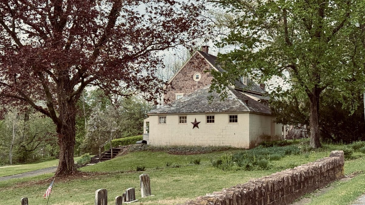 Old building and cemetery in a serene, historical landscape in Lancaster County.