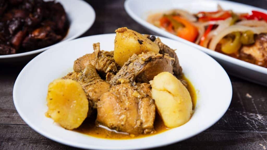 Close-up of Caribbean chicken stew with potatoes, perfect for lunch or dinner.