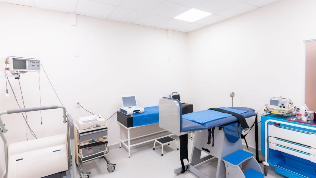 A clean and equipped medical examination room with diverse healthcare tools.