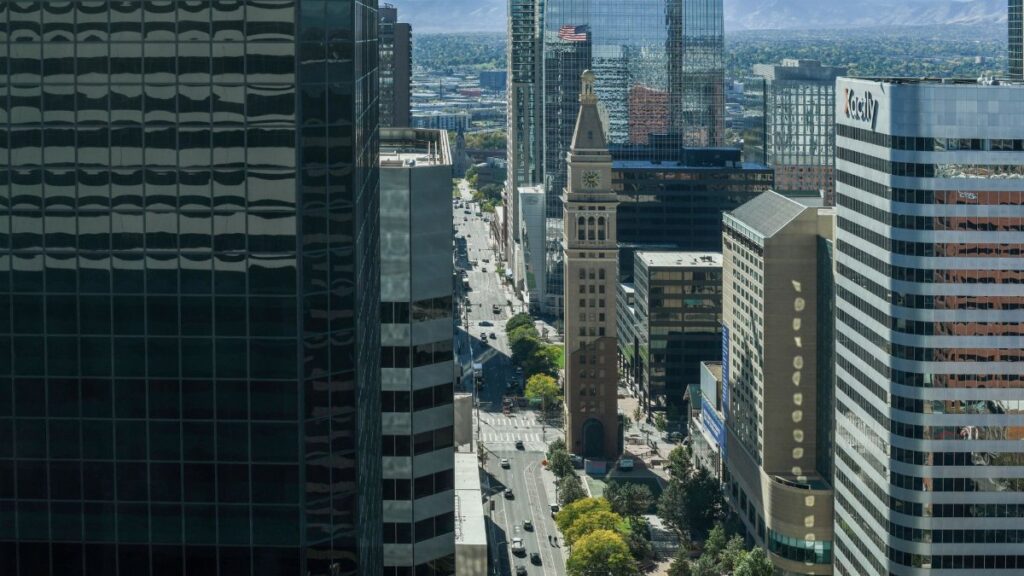 A stunning aerial view of downtown Denver showcasing the iconic clock tower amidst modern skyscrapers.