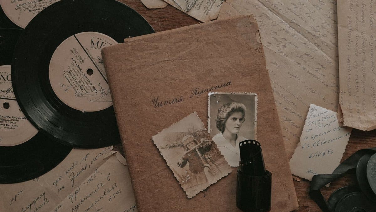 A nostalgic still life with vintage records, photos, and letters, evoking memories from the past.