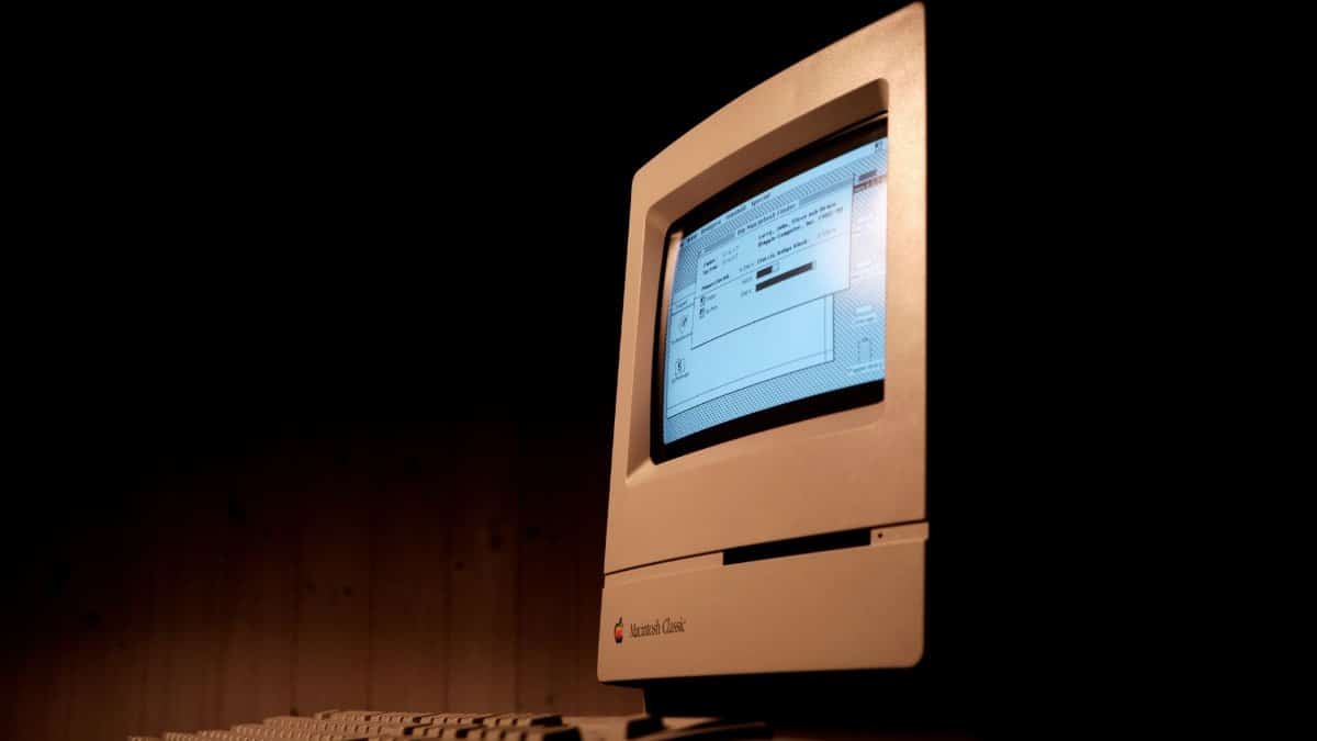 Close-up of a Macintosh Classic computer, showcasing vintage technology and nostalgia.