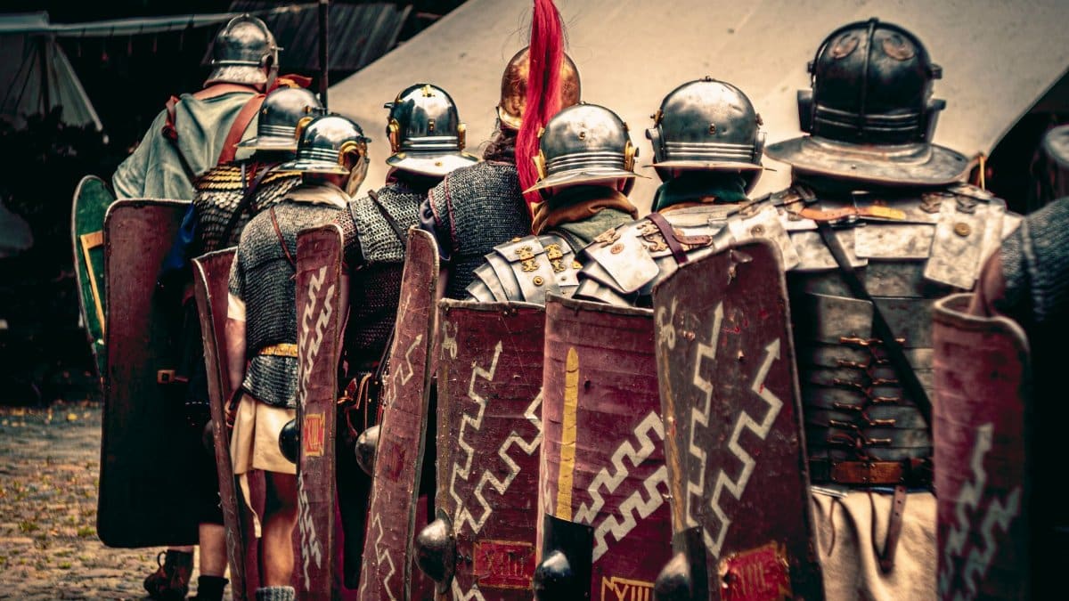 Reenactors in Roman legion outfits march in a historical festival in Wrocław, Poland.