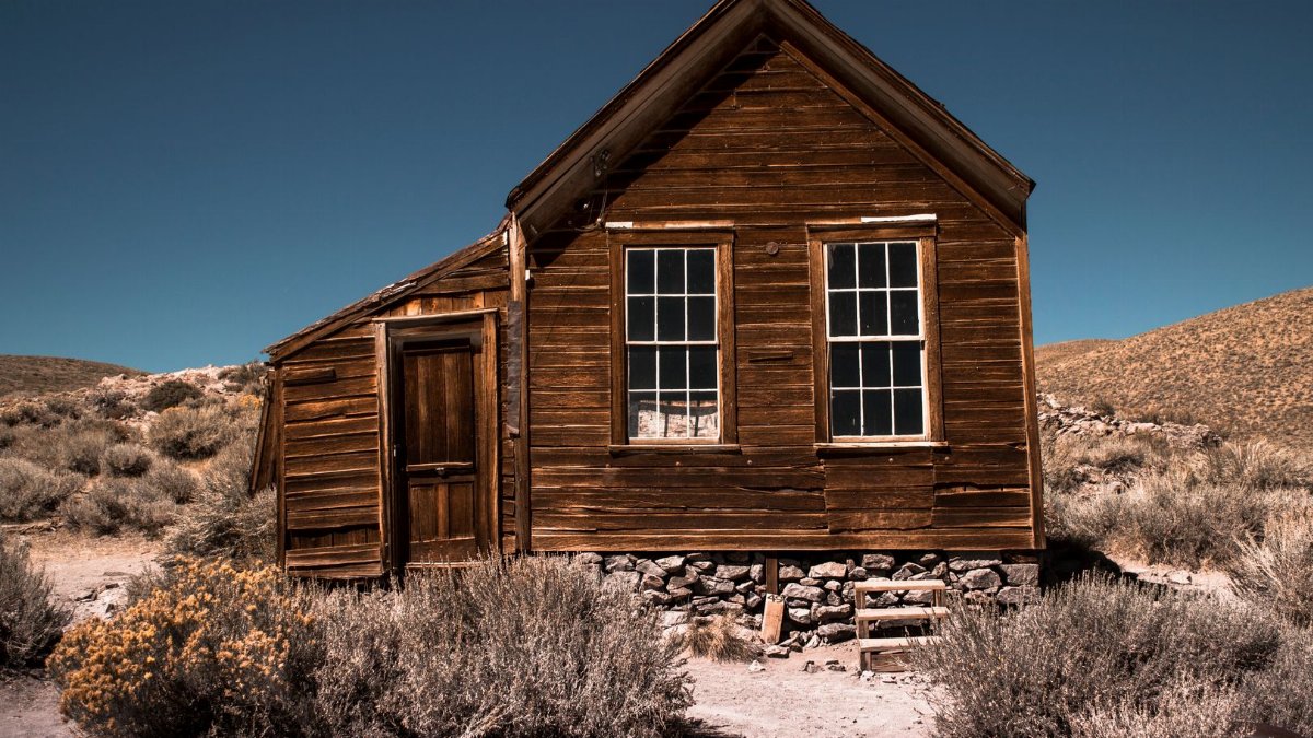 Explore this rustic wooden cabin amid the arid landscape of Bridgeport, California.