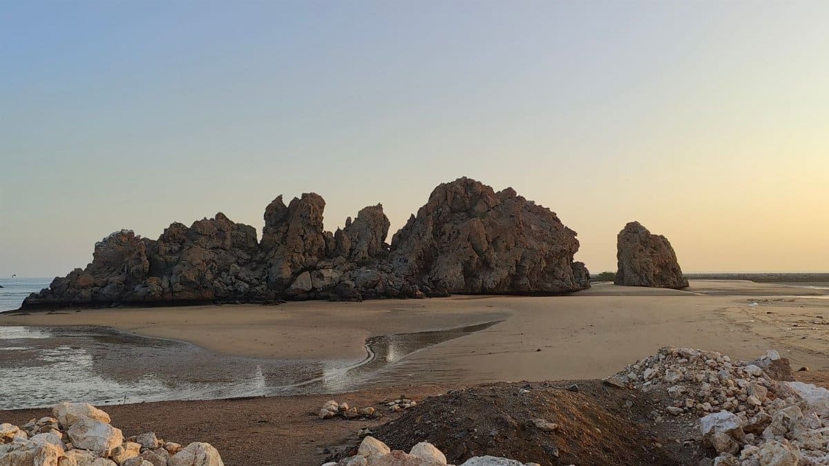 Captivating rock formations at sunset on Yiti Beach, Muscat, Oman.