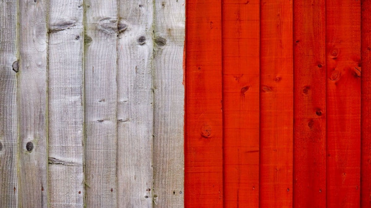 Background of old wooden planks painted with white and bright red colors