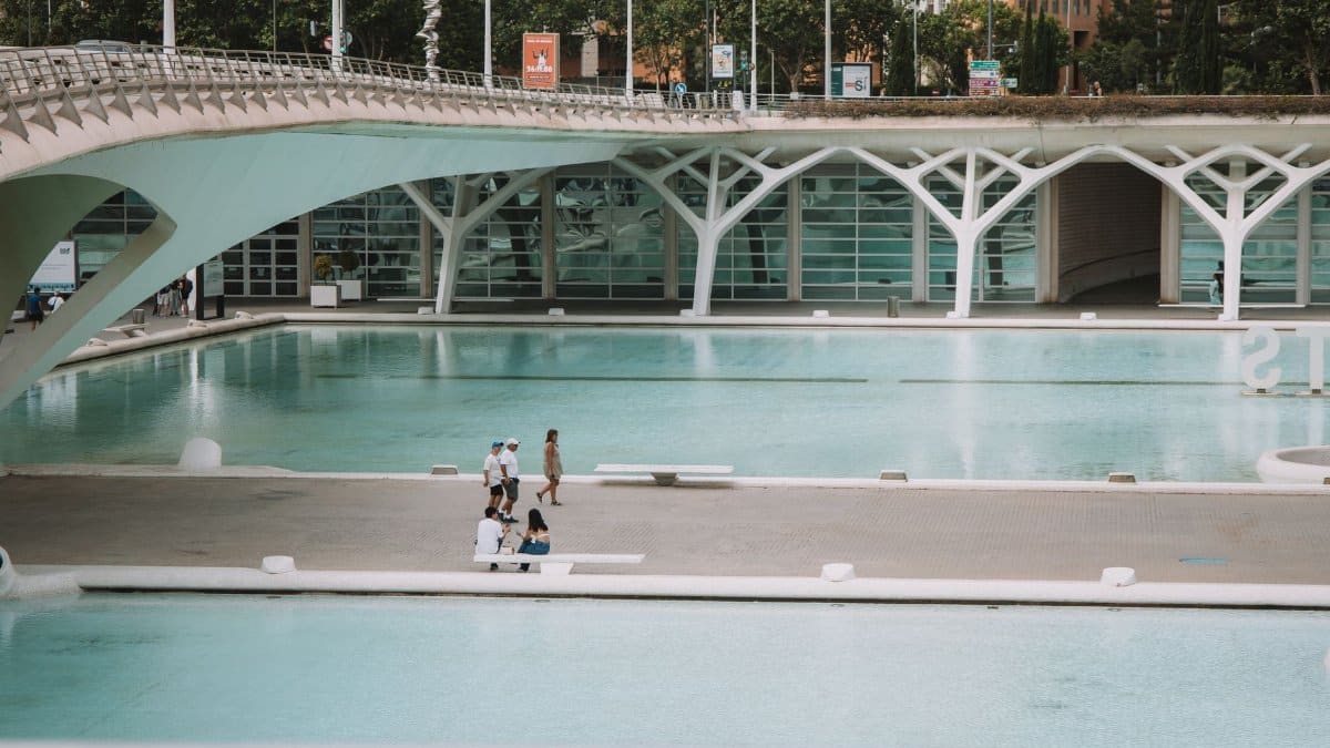 Relaxing scene at the City of Arts and Sciences, Valencia, Spain, showcasing modern architecture and pools.