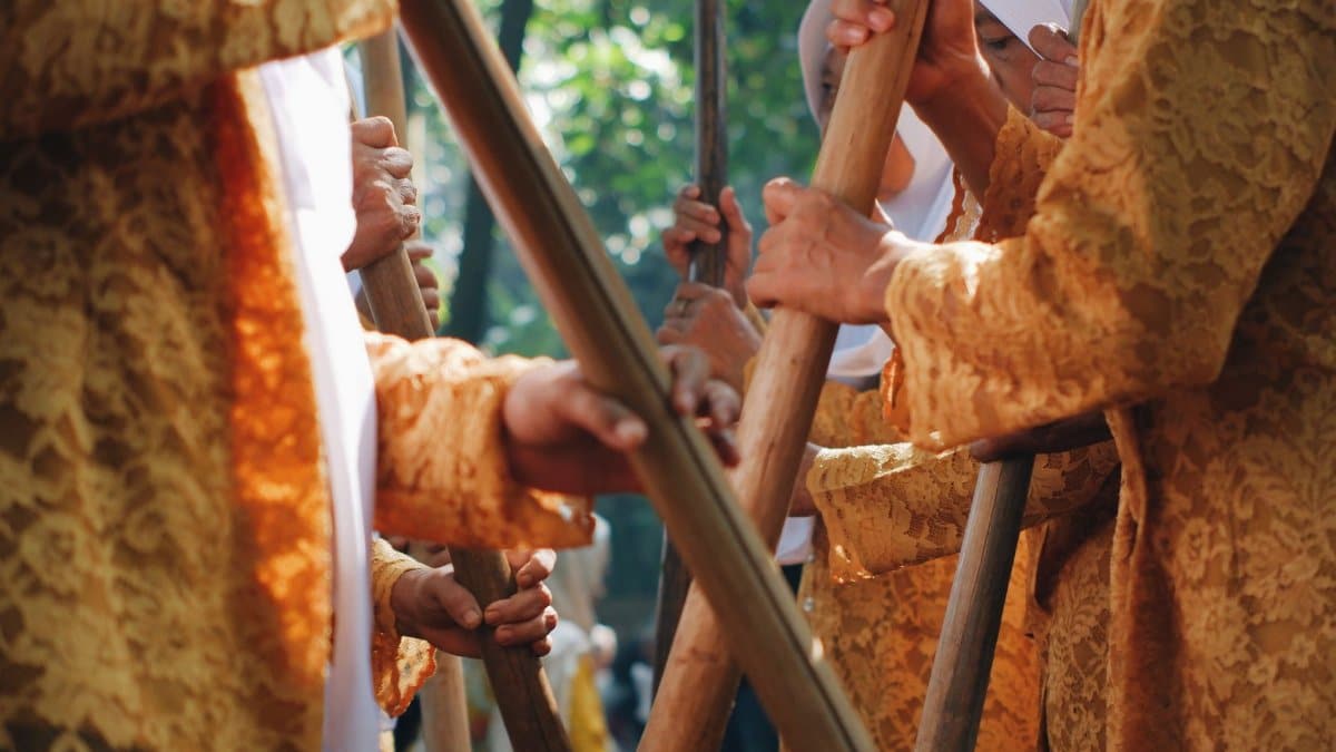Close-up of a traditional bamboo dance during a cultural event in West Java, Indonesia.