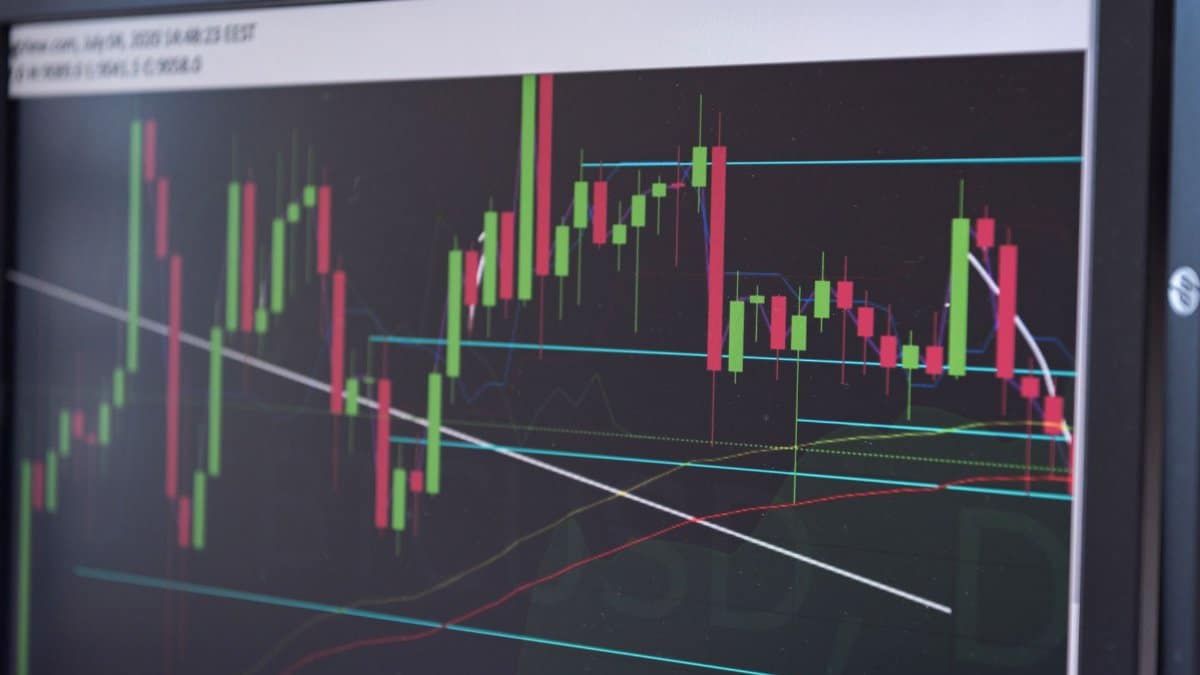 A close-up view of a cryptocurrency trading chart displayed on a monitor, showcasing market trends.