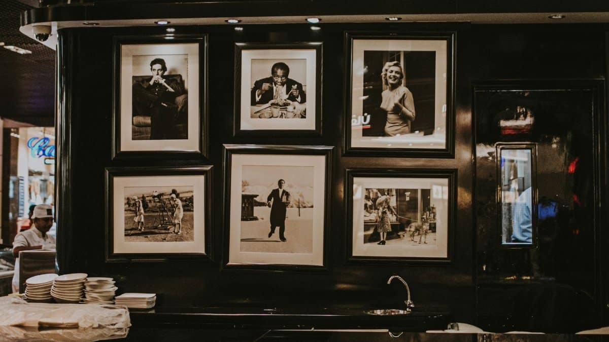 Discover a vintage photo display in a Dubai restaurant with iconic black and white prints.